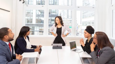 woman leading a meeting scaled